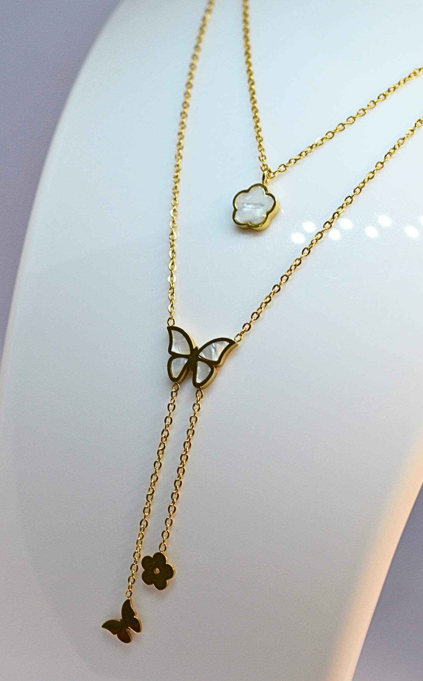 Stylish double chain with butterfly and flower pendant
