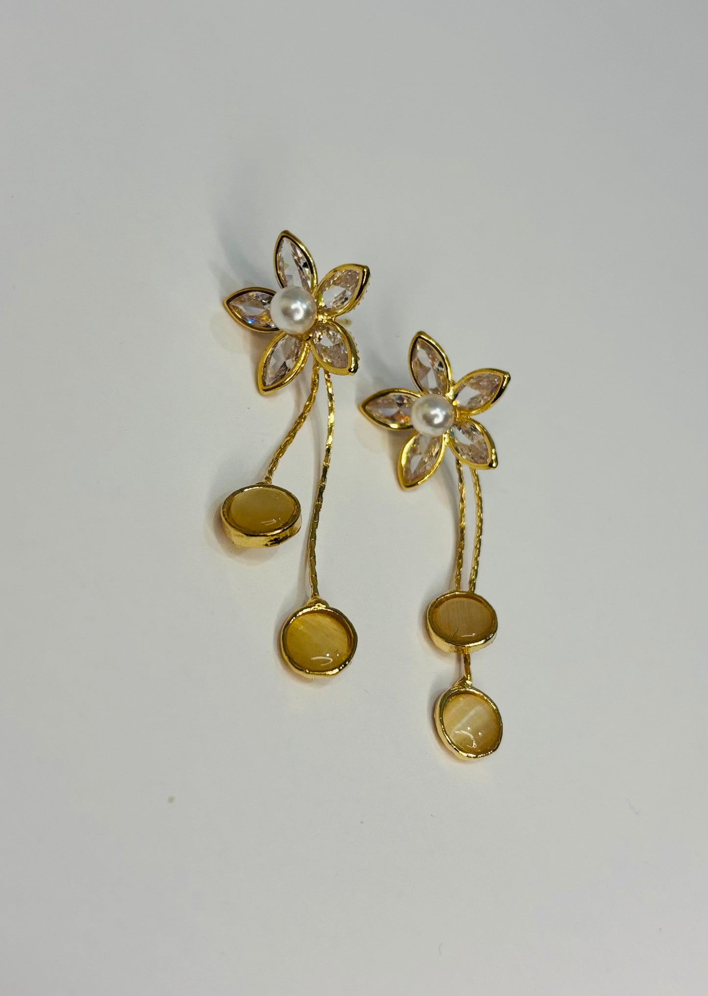 Flower with long tale design earrings