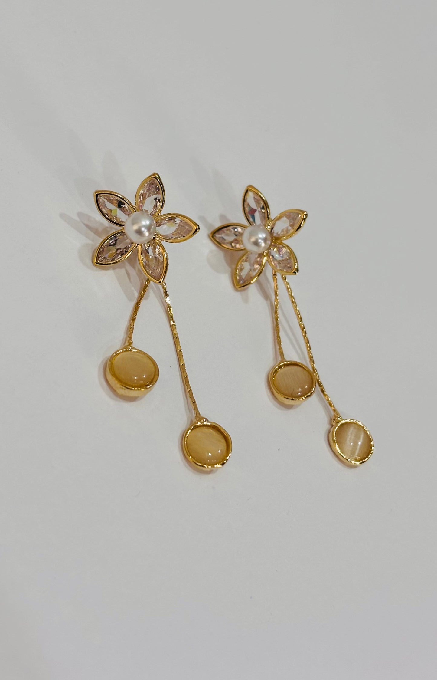 Flower with long tale design earrings