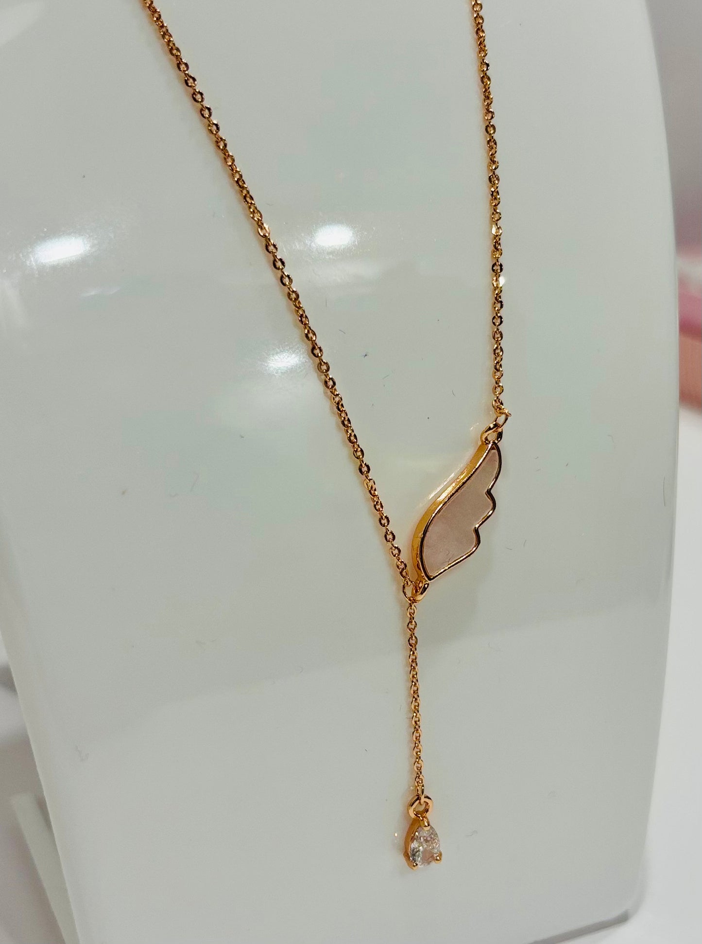 Rose gold necklace with single wing