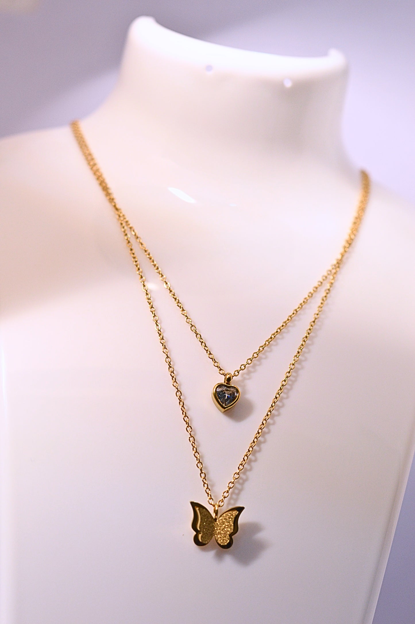 Stylish double chain with heart and butterfly pendant