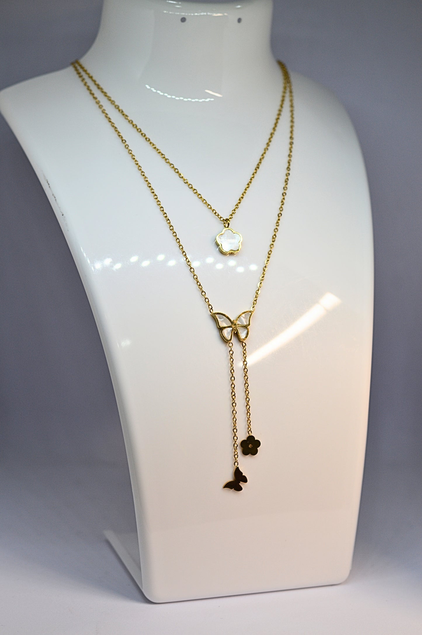 Stylish double chain with butterfly and flower pendant