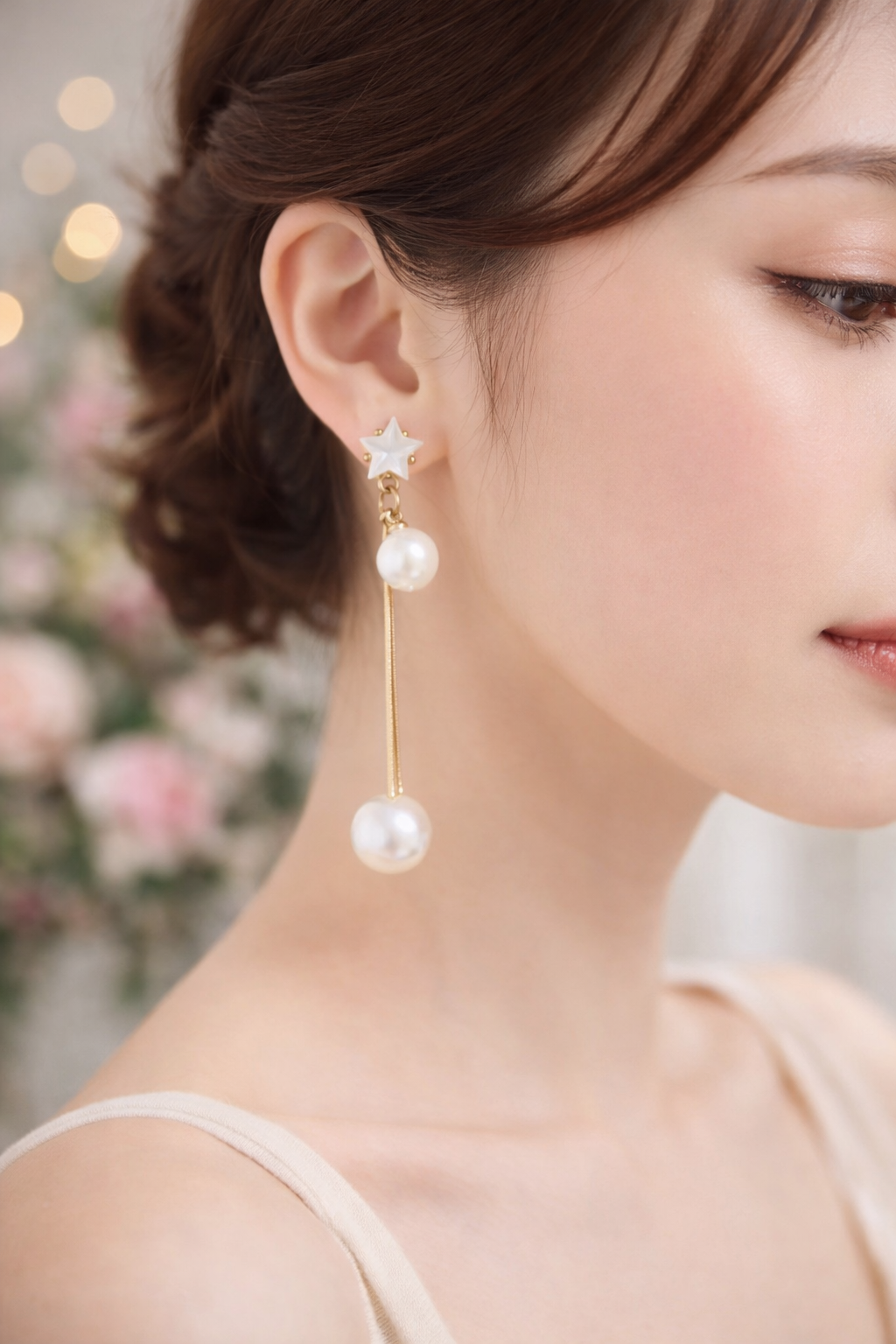 Earrings with hanging pearl
