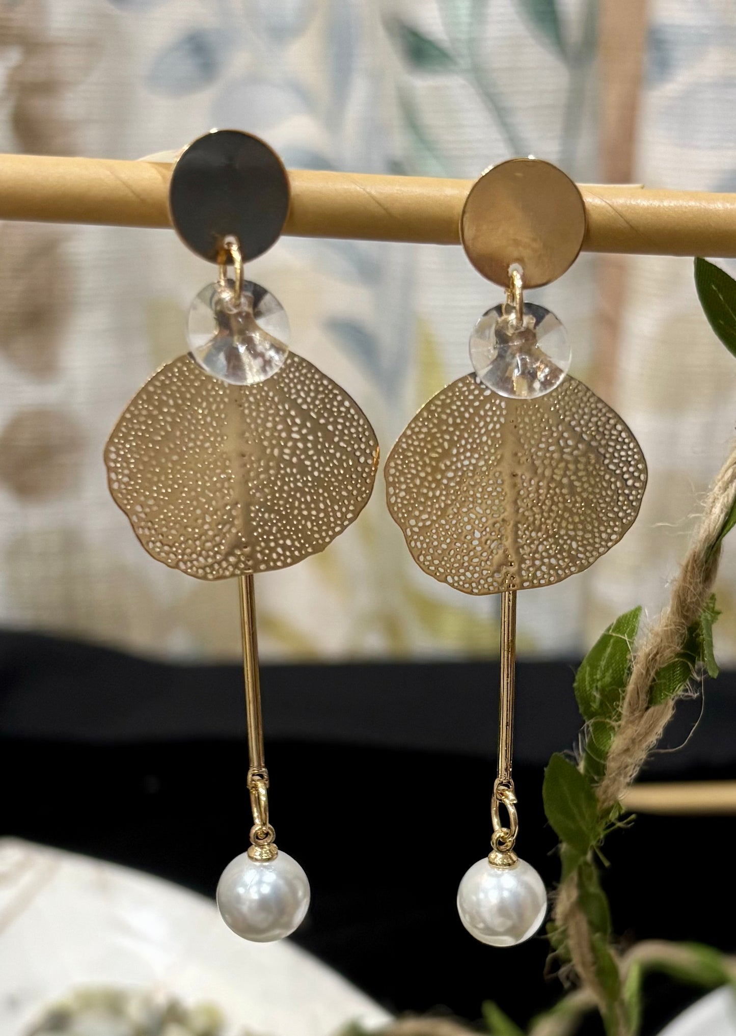 Earrings with hanging sacred fig leaf design