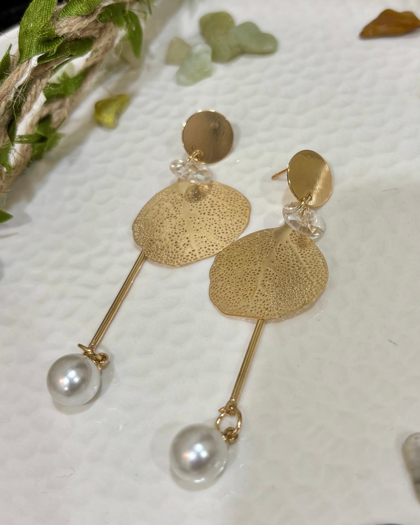 Earrings with hanging sacred fig leaf design