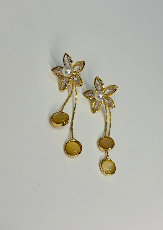 Flower with long tale design earrings