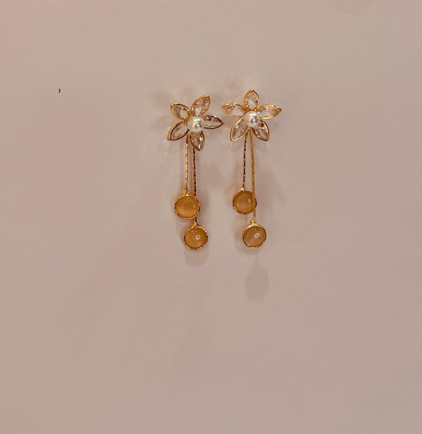 Flower with long tale design earrings